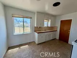 a kitchen with a stove a sink and a refrigerator