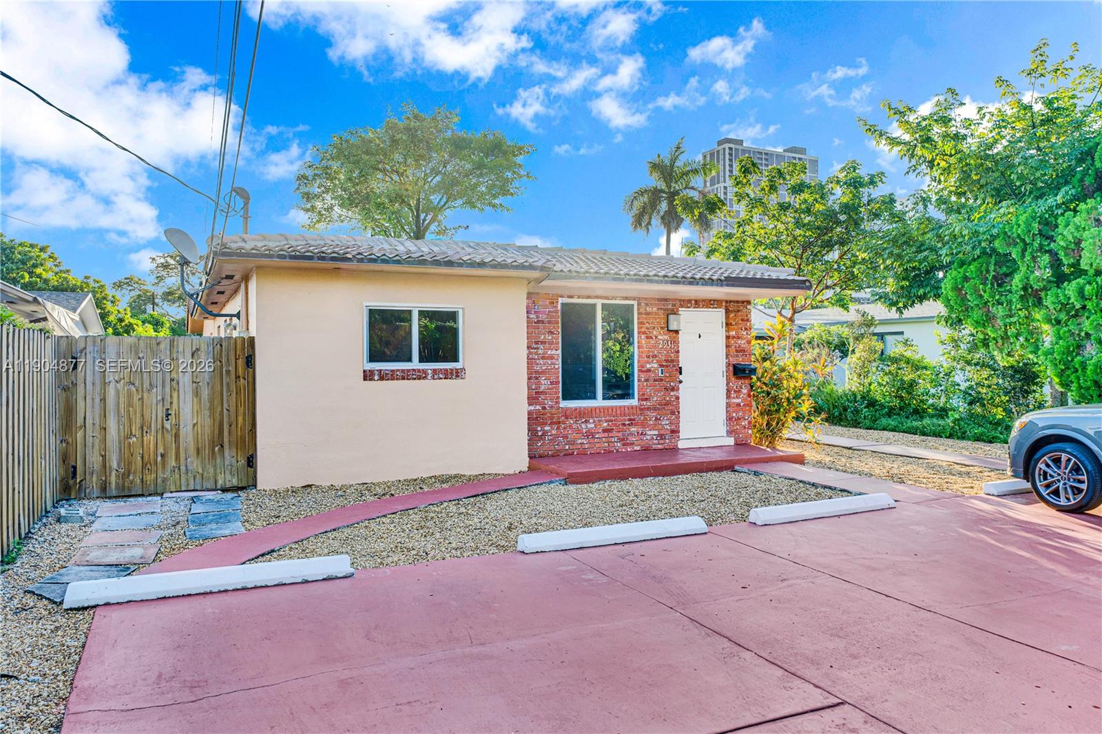 2931 Southwest 39th Avenue Miami, FL 33134 - Photo 23 of 27 a front view of a house with a yard and garage