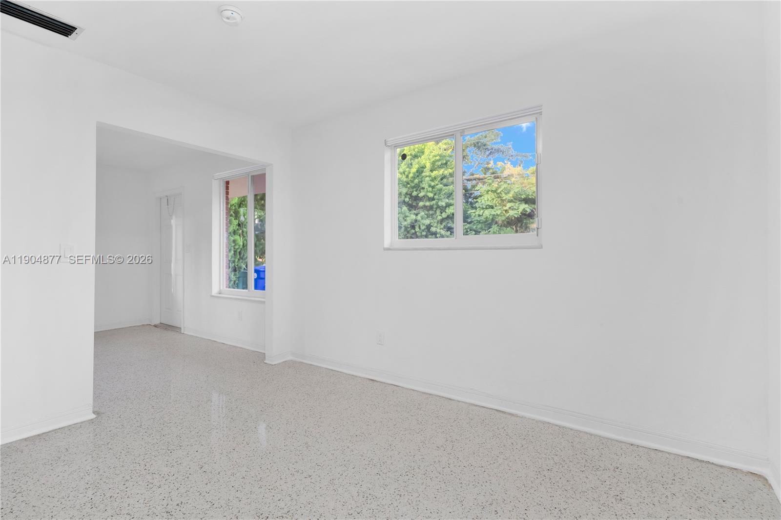 2931 Southwest 39th Avenue Miami, FL 33134 - Photo 5 of 27 an empty room with windows