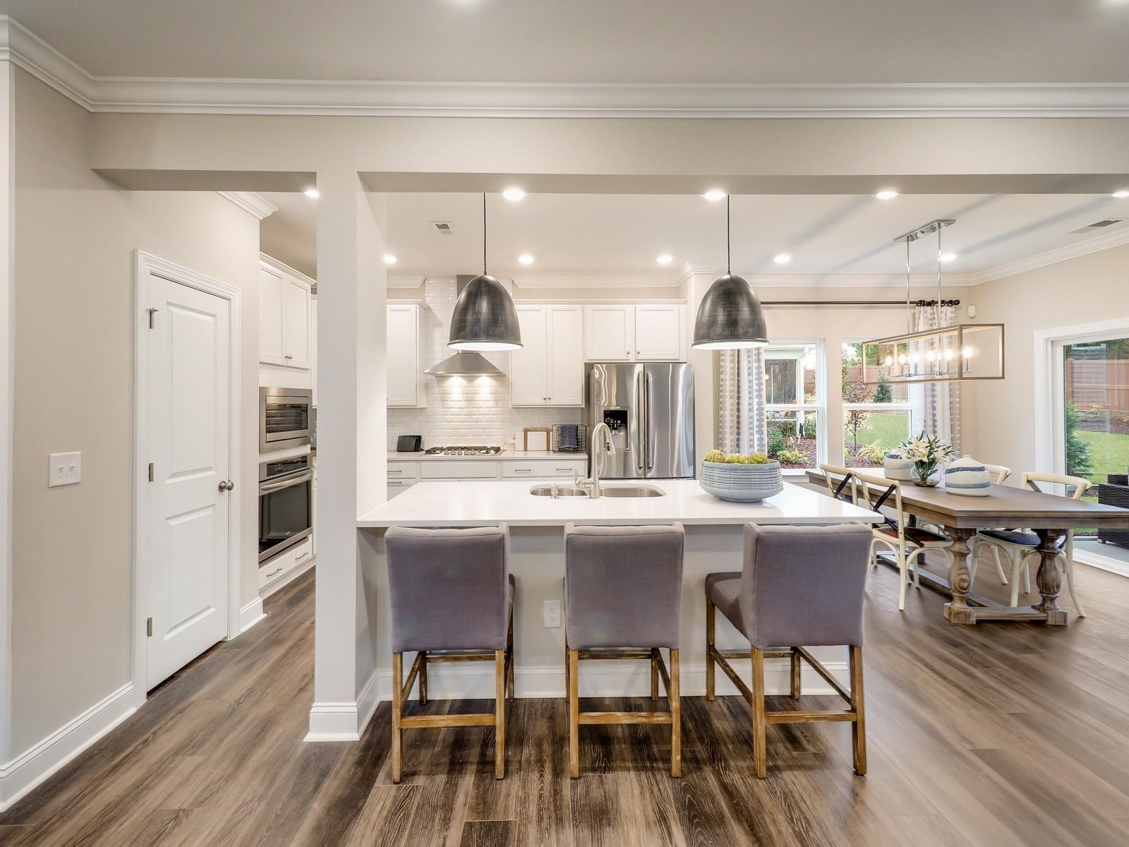 112 Keyshore Bend, Unit 163 Raleigh, NC 27610 - Photo 1 of 32 a large kitchen with a table and chairs
