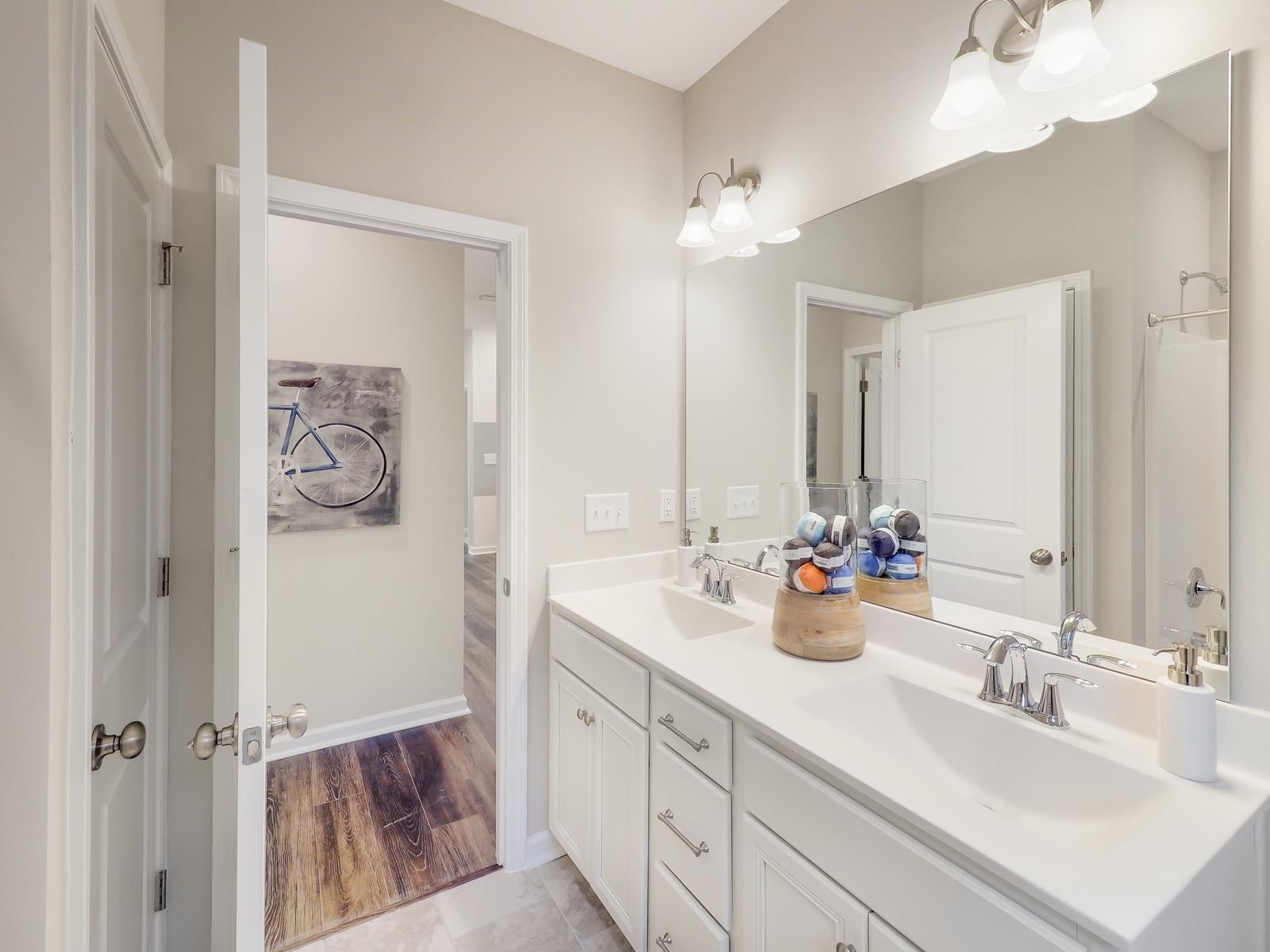 112 Keyshore Bend, Unit 163 Raleigh, NC 27610 - Photo 29 of 32 a bathroom with a double vanity sink mirror and double