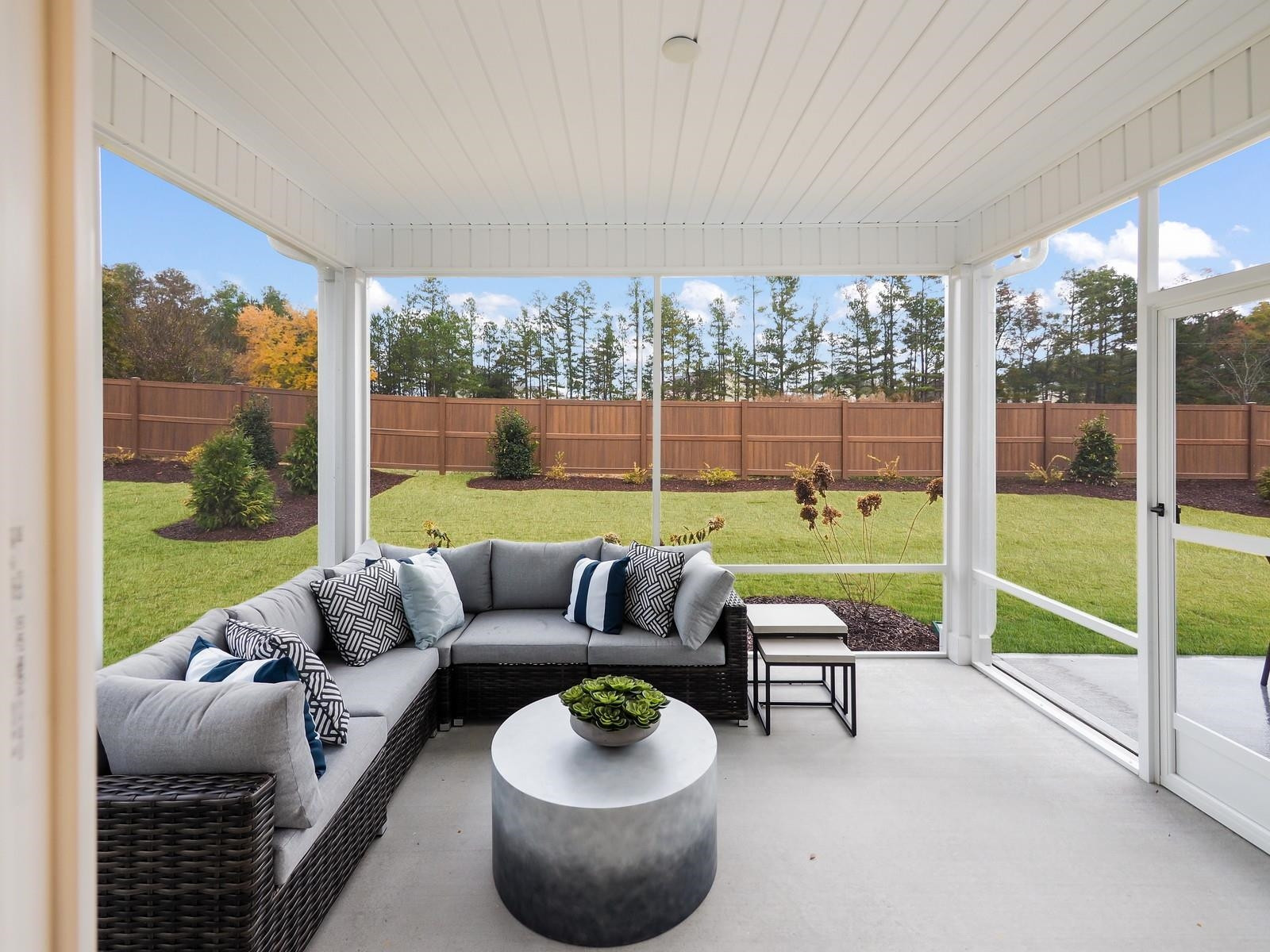 112 Keyshore Bend, Unit 163 Raleigh, NC 27610 - Photo 30 of 32 a living room with furniture and a large window