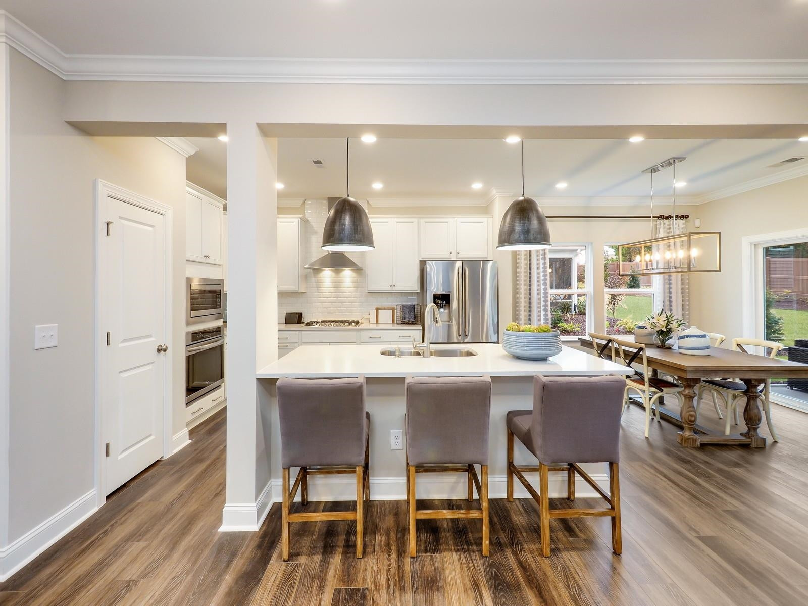 112 Keyshore Bend, Unit 163 Raleigh, NC 27610 - Photo 5 of 32 a large kitchen with a table and chairs