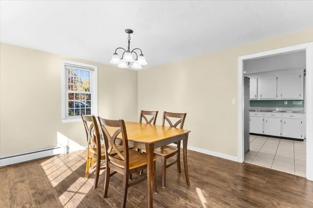 a kitchen with a refrigerator and a stove top oven