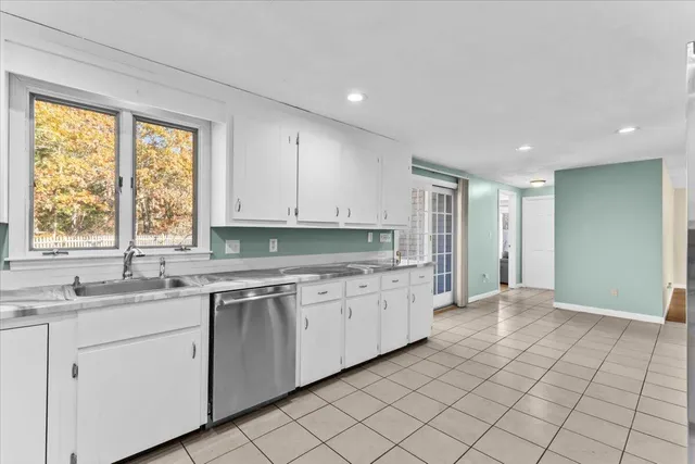 a bedroom with a bed and a fireplace