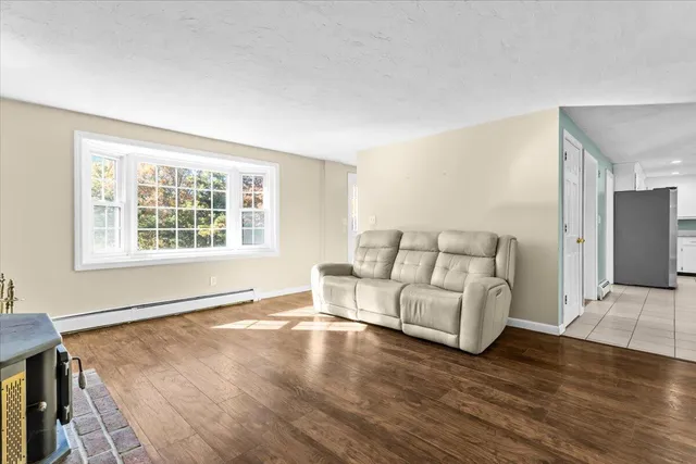 a white toilet sitting next to a shower