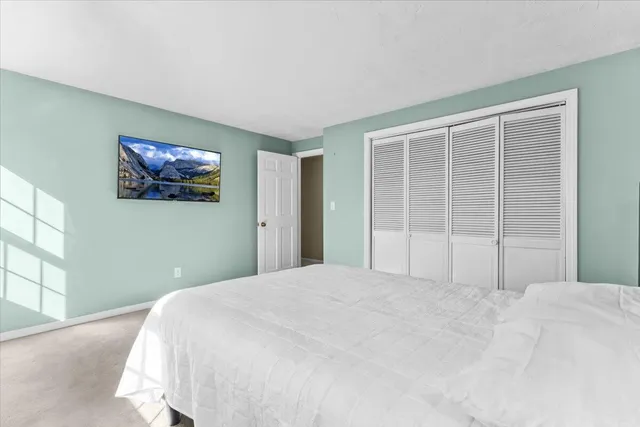 a view of a house with wooden deck and furniture