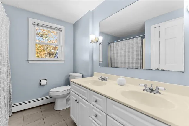 a view of yard with tree and wooden fence