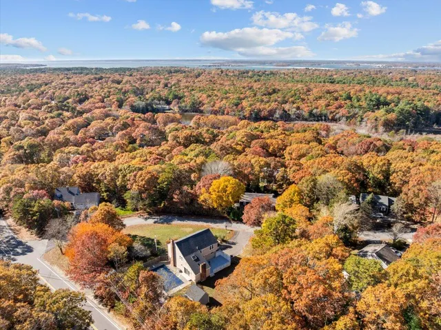 a view of a dining room with furniture wooden floor and a chandelier