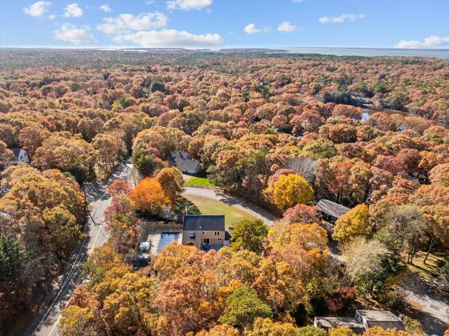 a view of a dining room with furniture wooden floor and chandelier