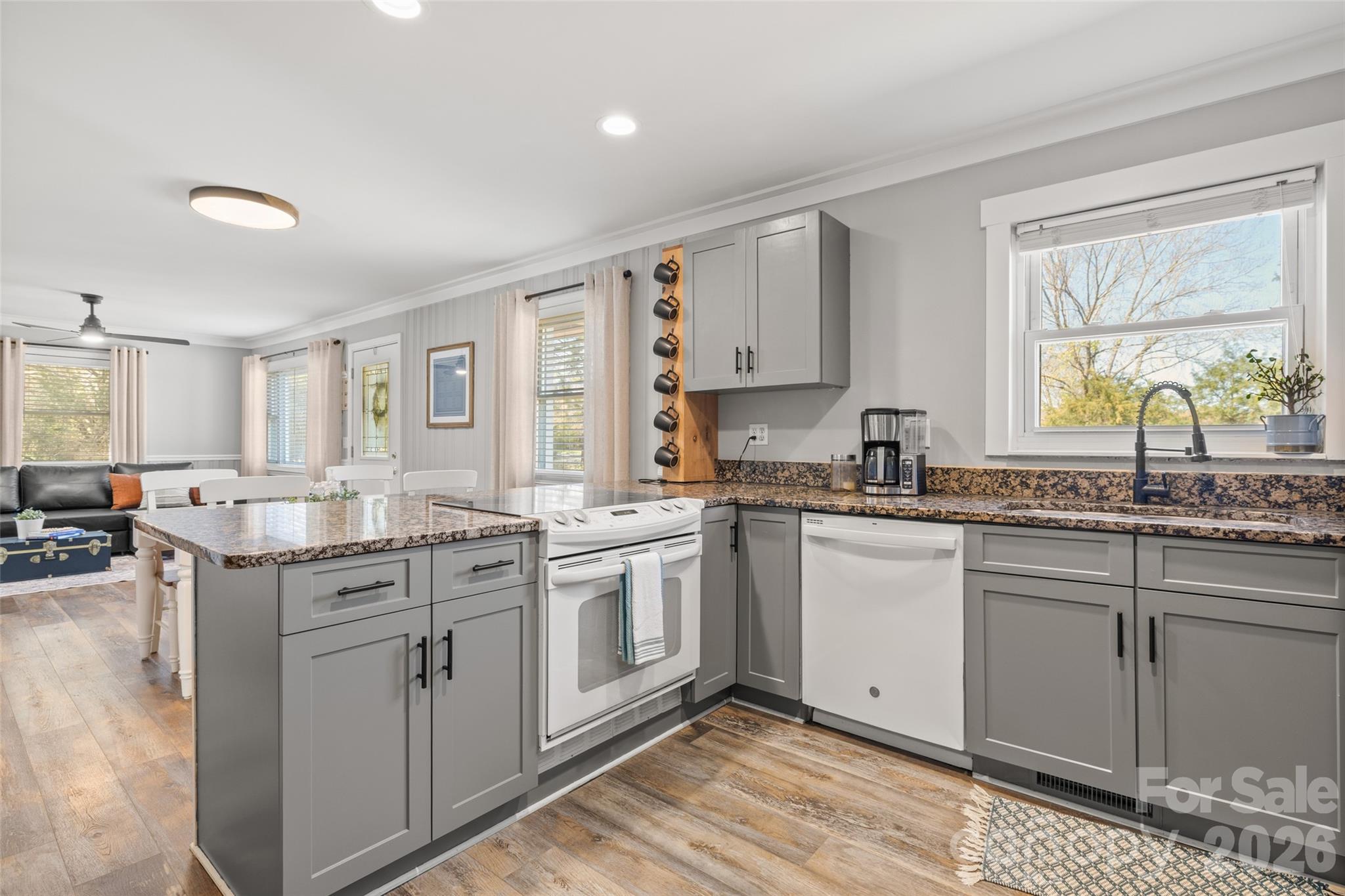 4790 Polk Ford Road Stanfield, NC 28163 - Photo 11 of 45 a kitchen with stainless steel appliances granite countertop a sink and cabinets