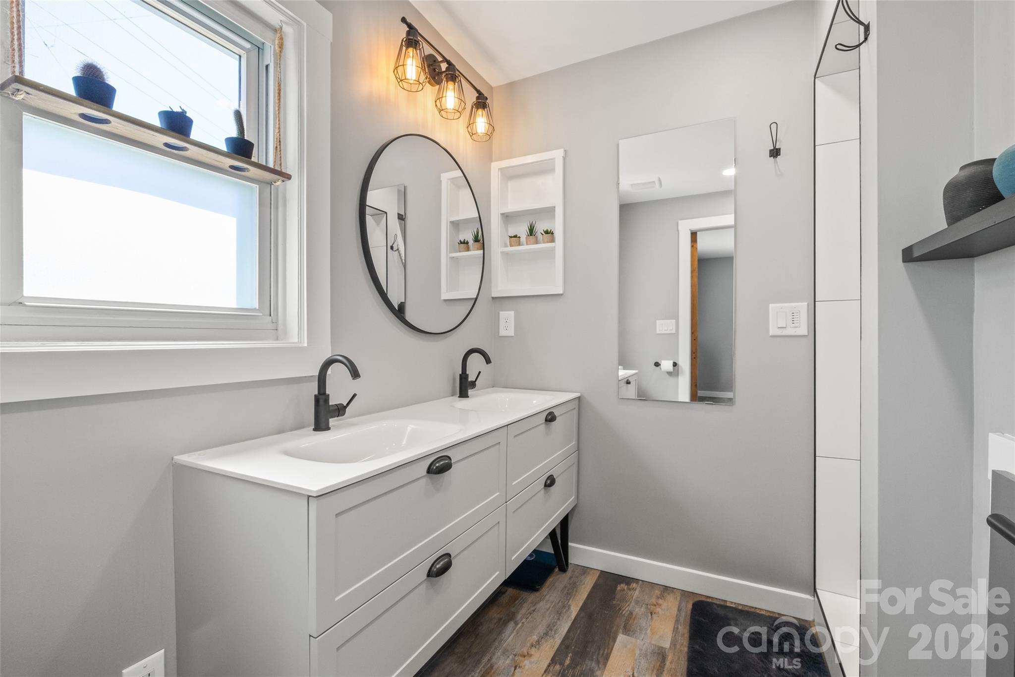 4790 Polk Ford Road Stanfield, NC 28163 - Photo 16 of 45 a bathroom with a sink and a mirror