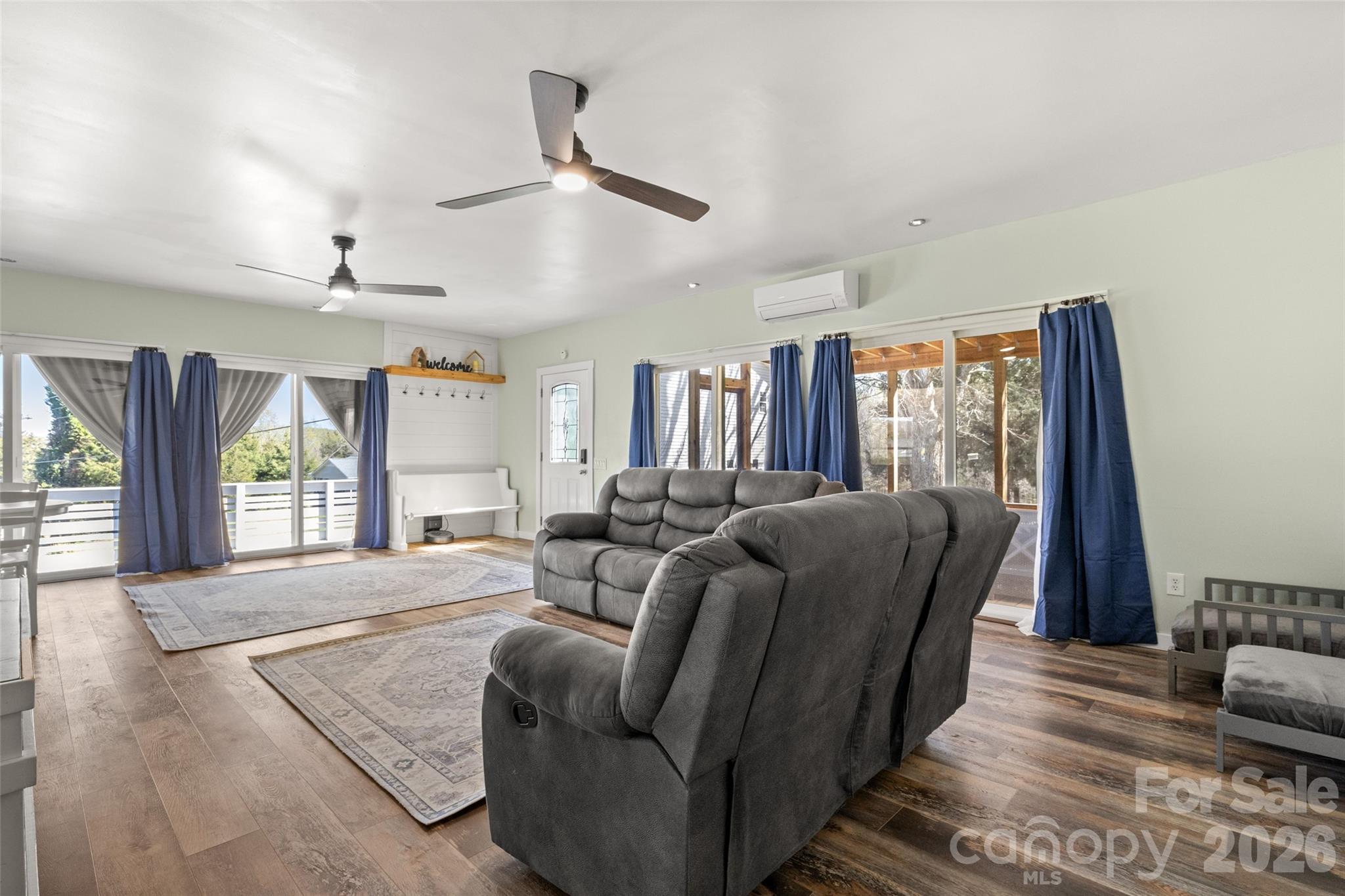 4790 Polk Ford Road Stanfield, NC 28163 - Photo 21 of 45 a living room with furniture large window and wooden floor