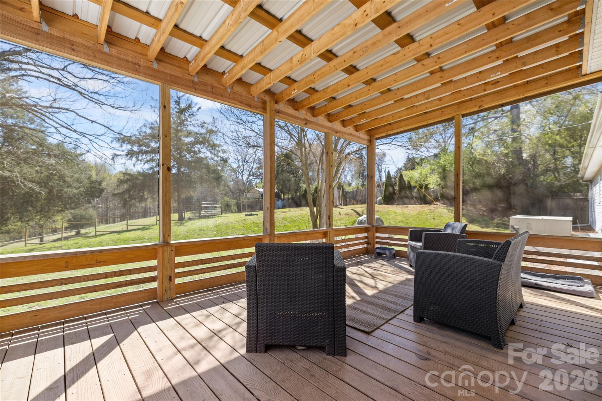4790 Polk Ford Road Stanfield, NC 28163 - Photo 24 of 45 a living room with couches and flat screen tv next to a yard