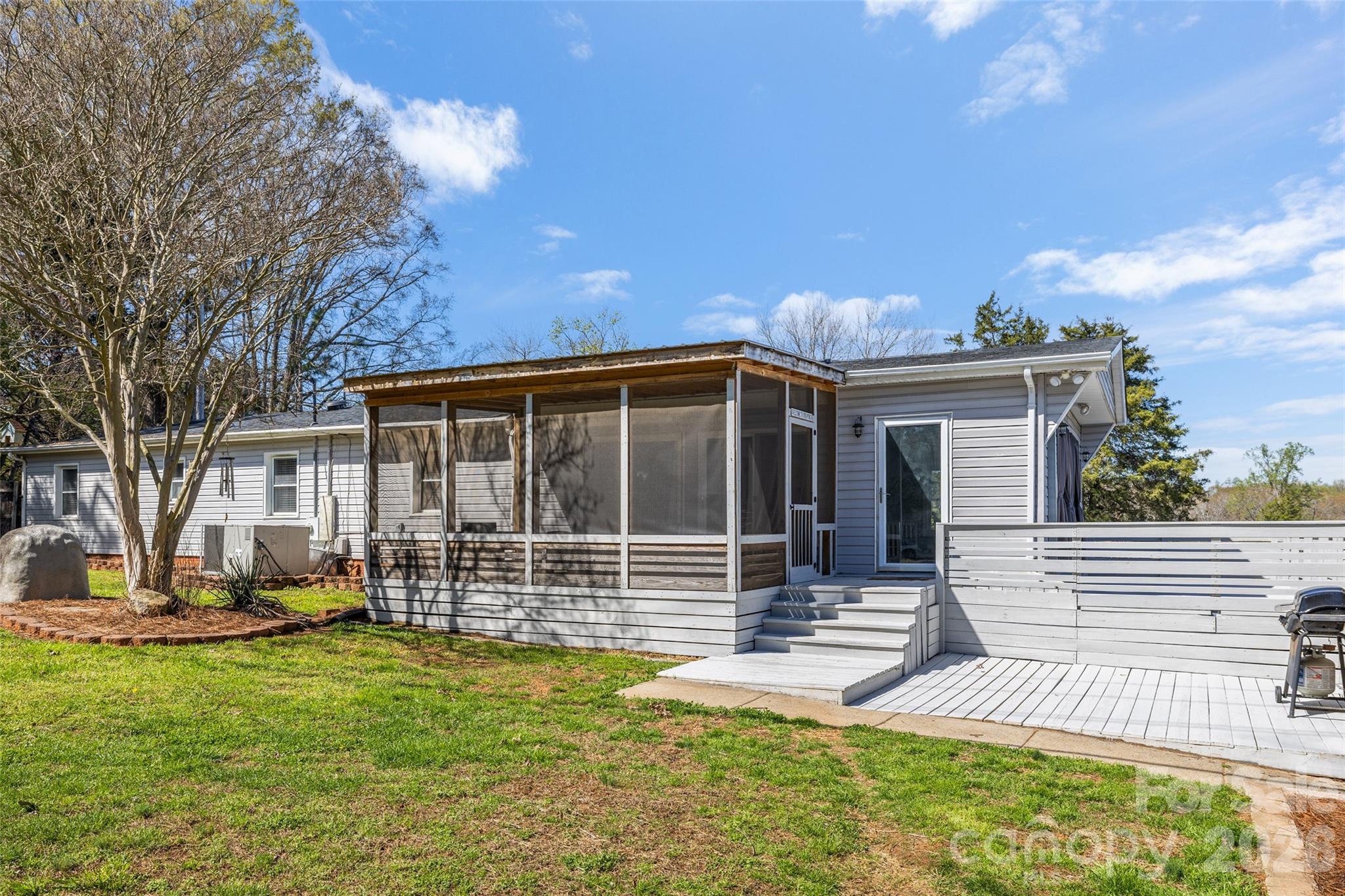 4790 Polk Ford Road Stanfield, NC 28163 - Photo 27 of 45 a view of house with backyard and outdoor seating