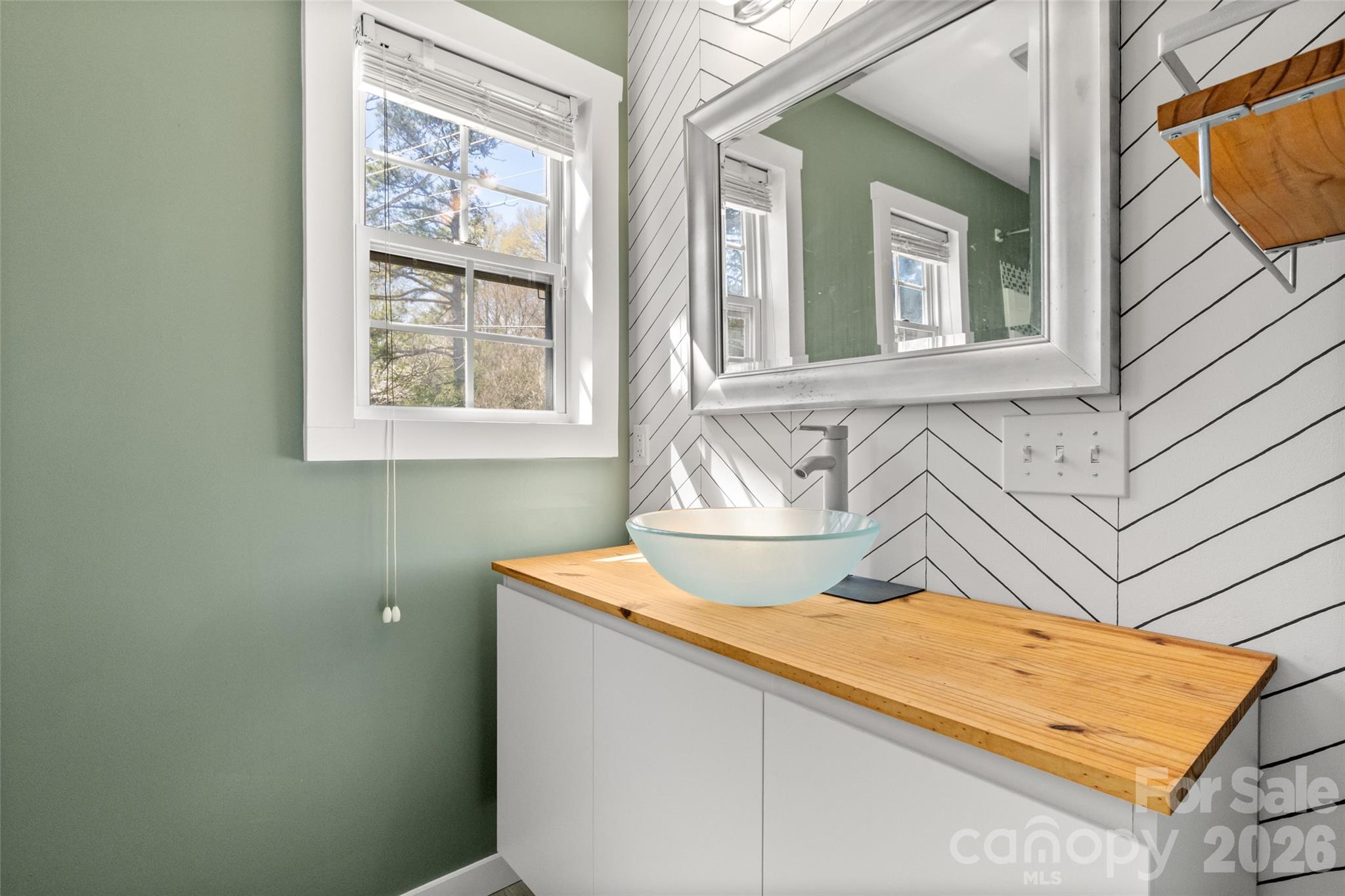 4790 Polk Ford Road Stanfield, NC 28163 - Photo 39 of 45 a bathroom with a sink and a mirror