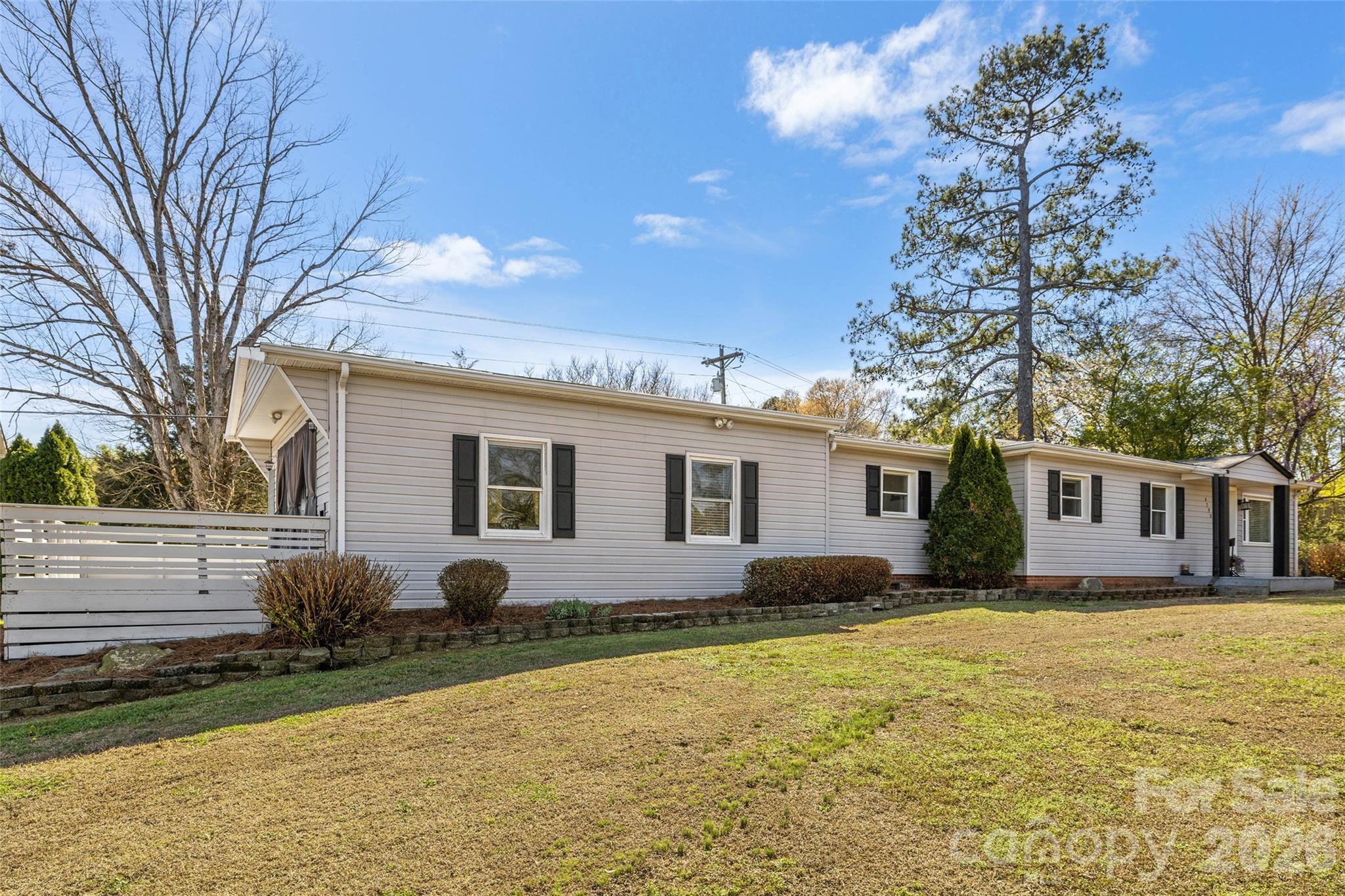 4790 Polk Ford Road Stanfield, NC 28163 - Photo 4 of 45 a house view with a garden space