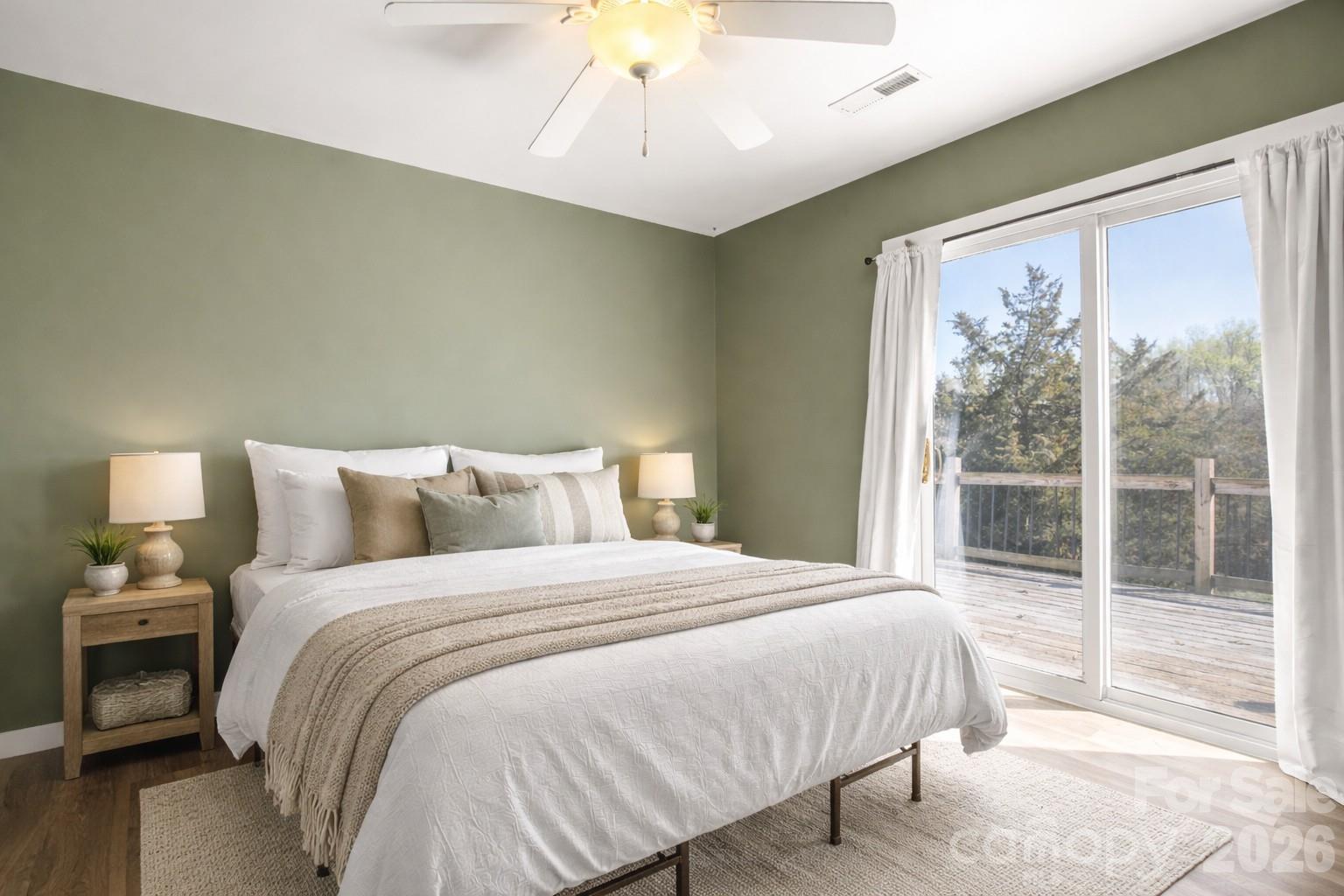 4790 Polk Ford Road Stanfield, NC 28163 - Photo 41 of 45 a bedroom with a large bed and a chandelier