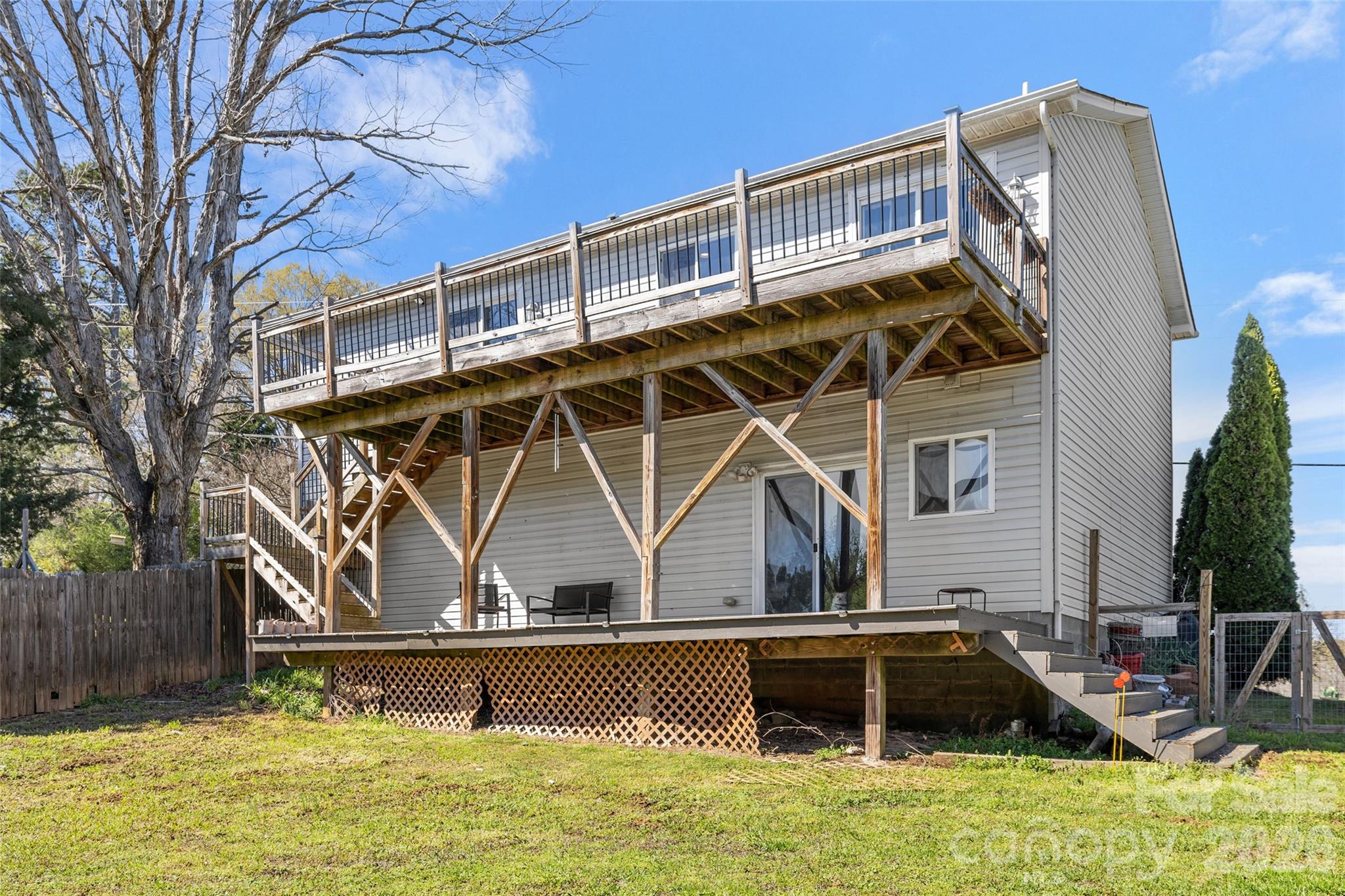 4790 Polk Ford Road Stanfield, NC 28163 - Photo 43 of 45 a view of a house with backyard and deck