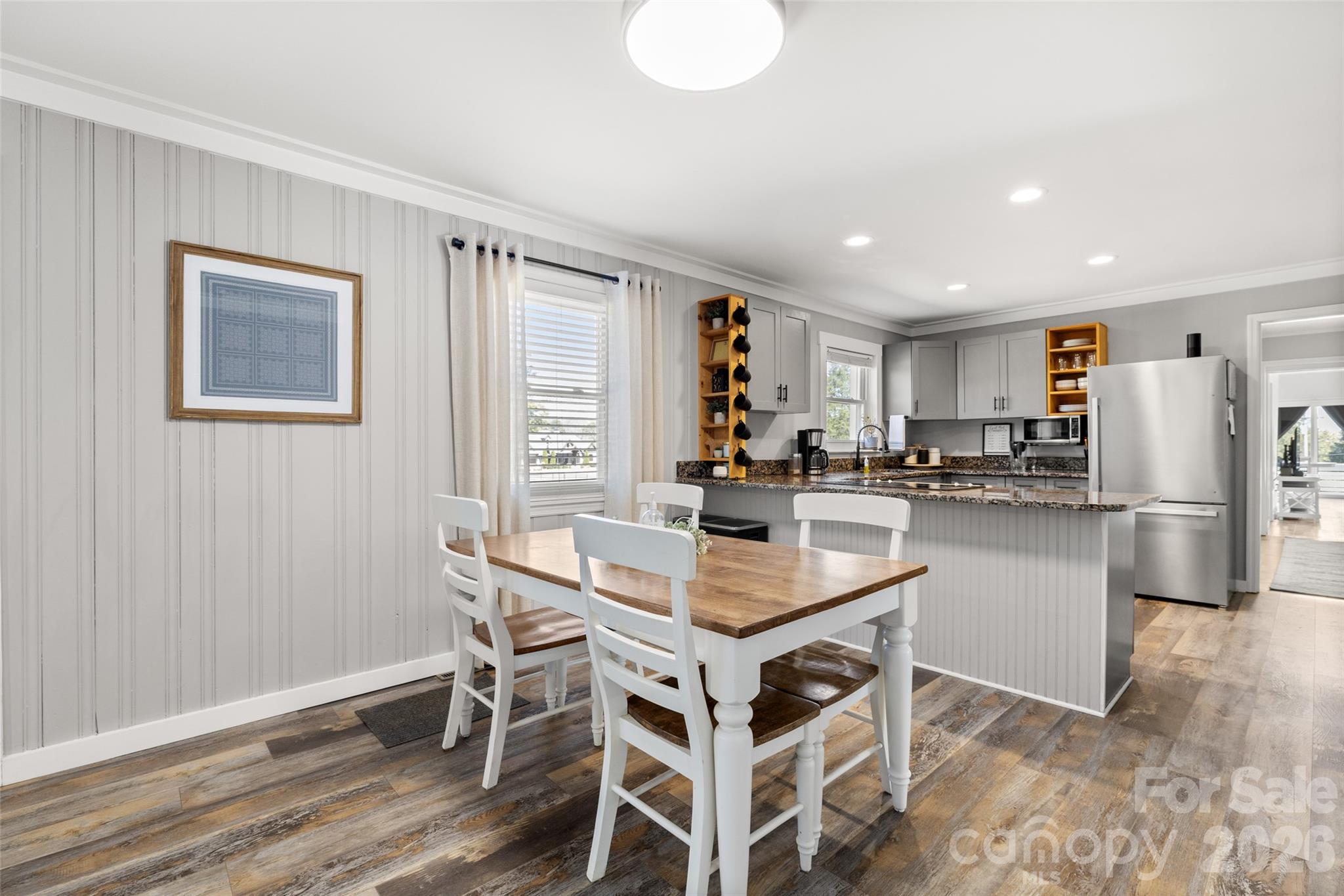 4790 Polk Ford Road Stanfield, NC 28163 - Photo 9 of 45 a kitchen with a table and chairs