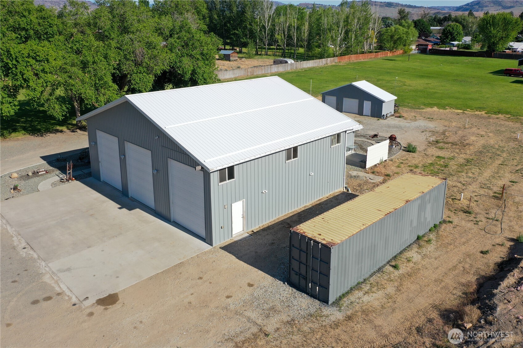 46 Shumway Road Omak, WA 98841 - Photo 5 of 40 a view of backyard with swimming pool and green space