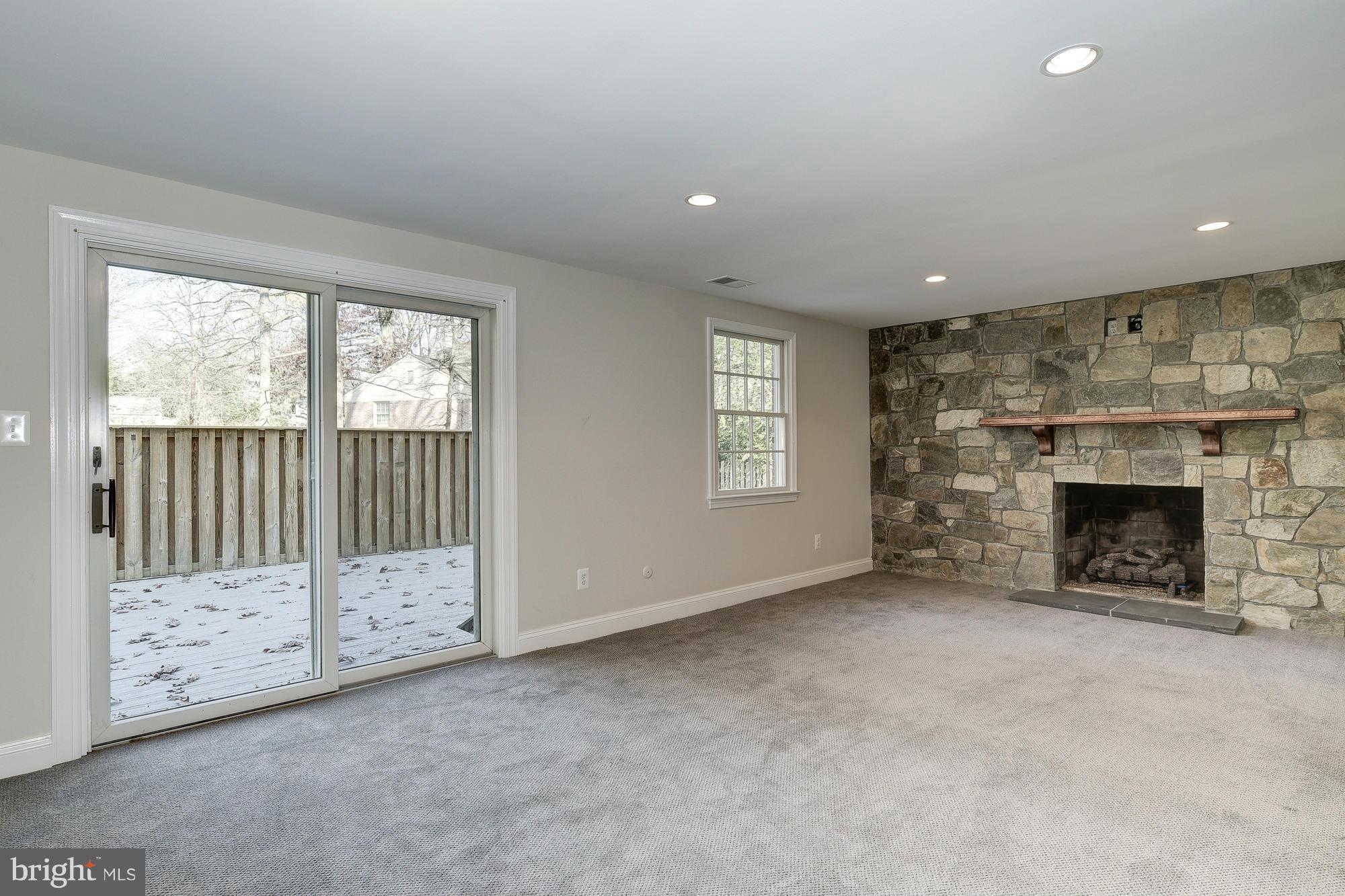 8207 Postoak Road Potomac, MD 20854 - Photo 14 of 30 Family Room with new stone wall and gas FP