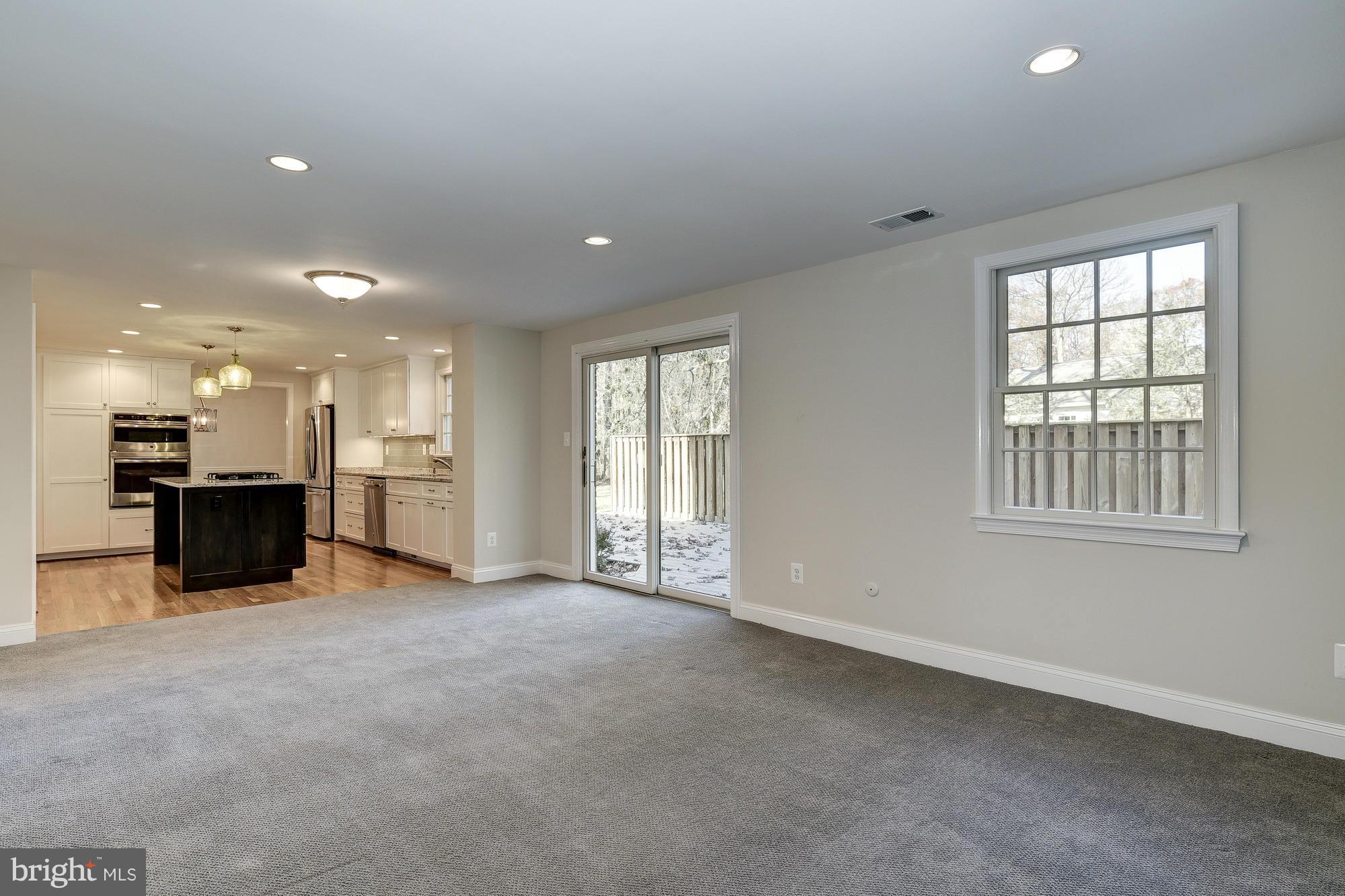 8207 Postoak Road Potomac, MD 20854 - Photo 15 of 30 Family Room with sliding glass door to deck