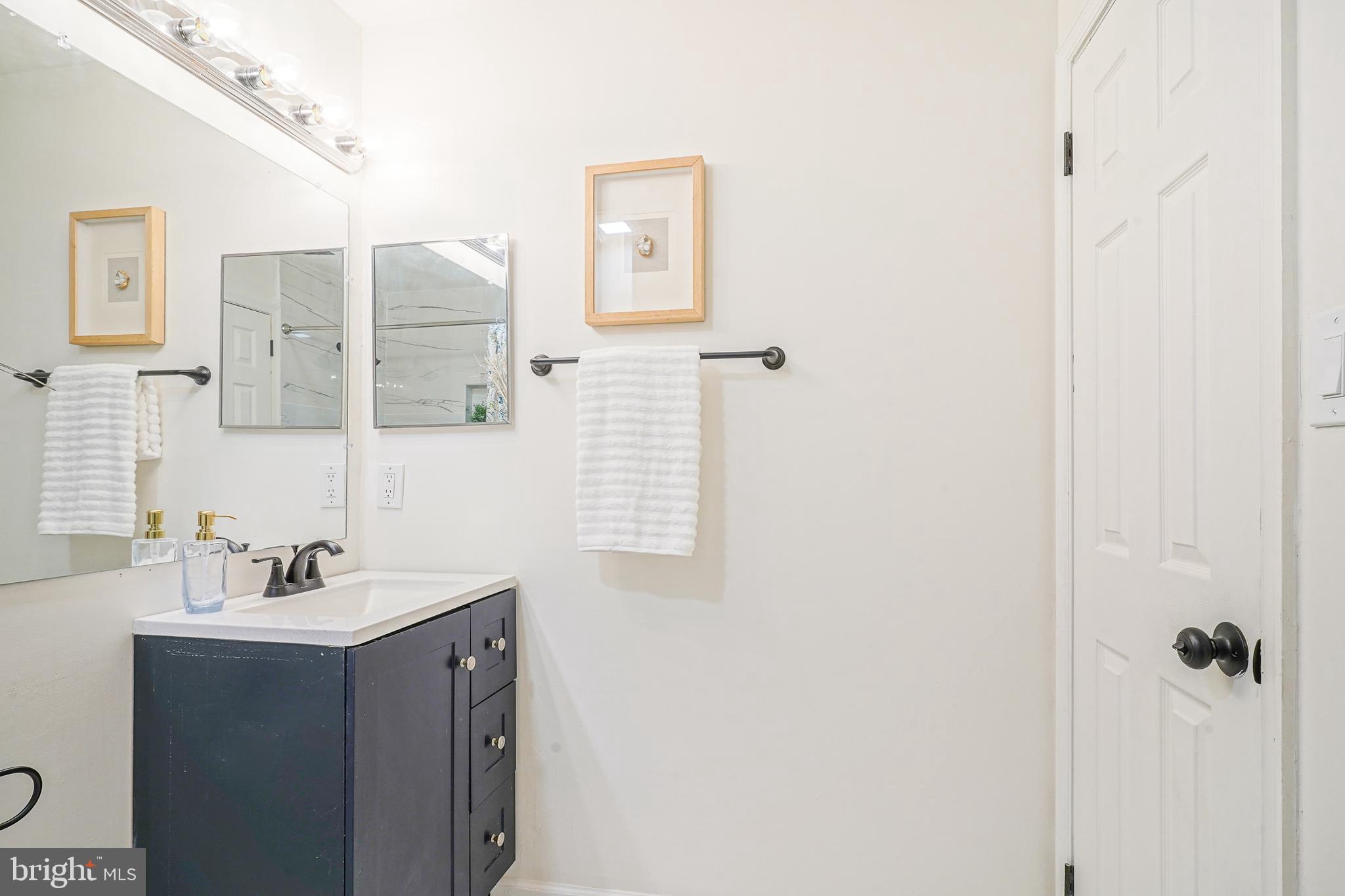 1104 B Ralston Drive Mount Laurel, NJ 08054 - Photo 13 of 24 a bathroom with a sink and a mirror