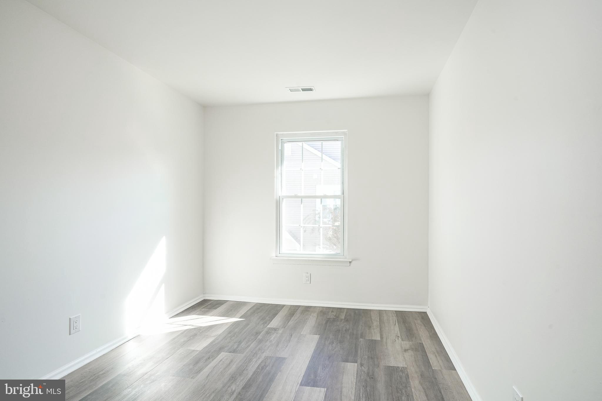 1104 B Ralston Drive Mount Laurel, NJ 08054 - Photo 18 of 24 an empty room with wooden floor and windows