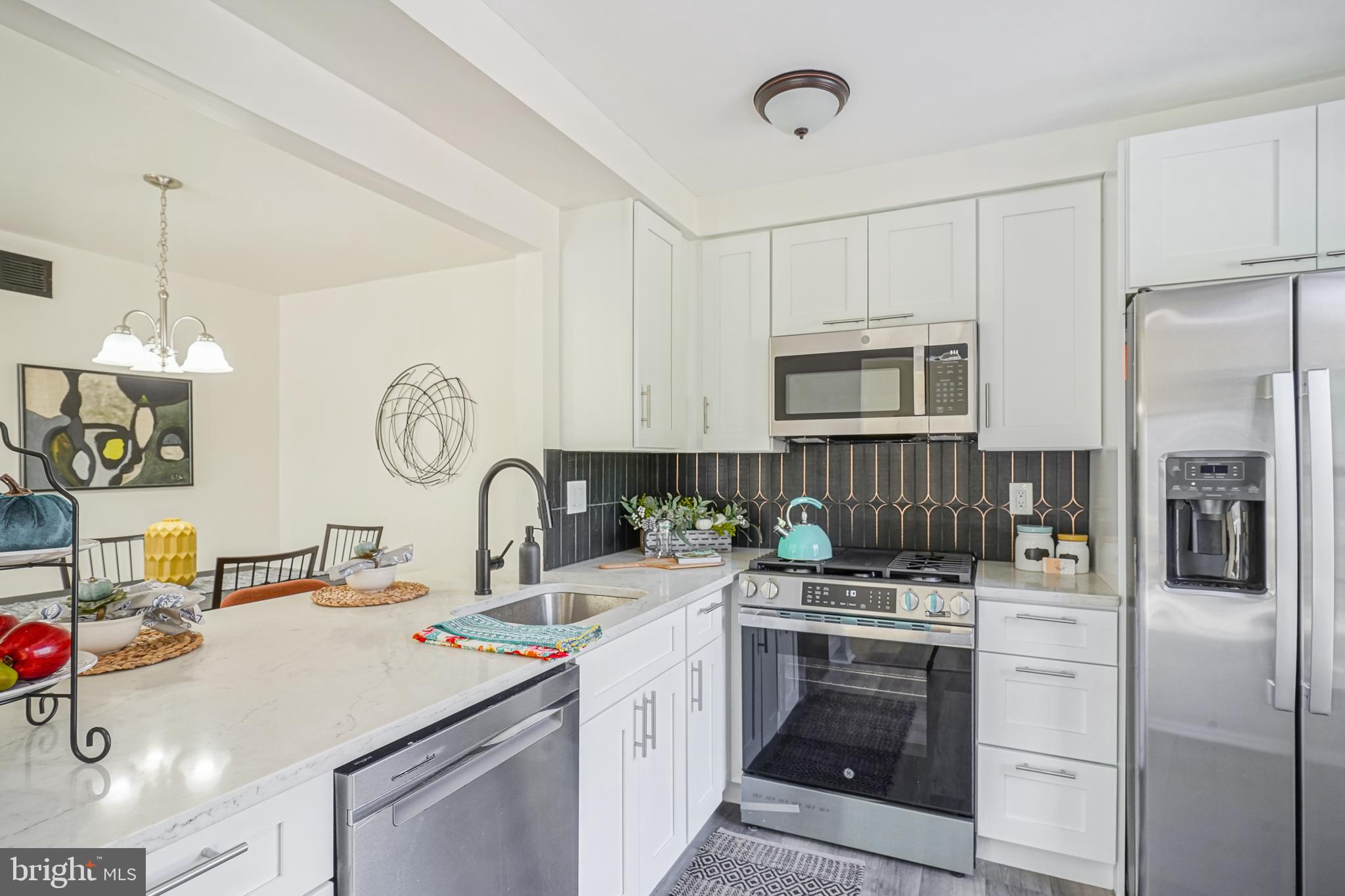 1104 B Ralston Drive Mount Laurel, NJ 08054 - Photo 10 of 24 a kitchen with a sink stove and refrigerator