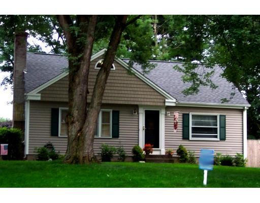 83 Prouty Street Springfield, MA 01119 - Photo 1 of 2 a front view of a house with a yard and trees