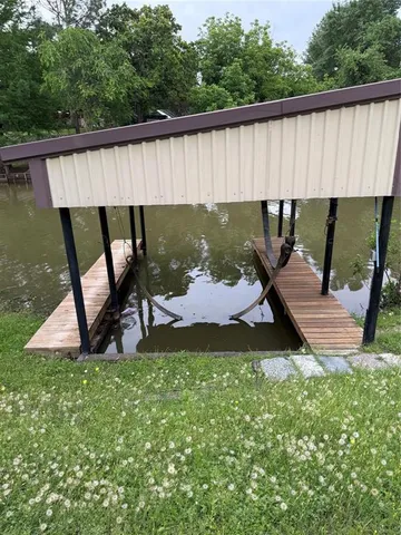 a view of a patio with a table and chairs