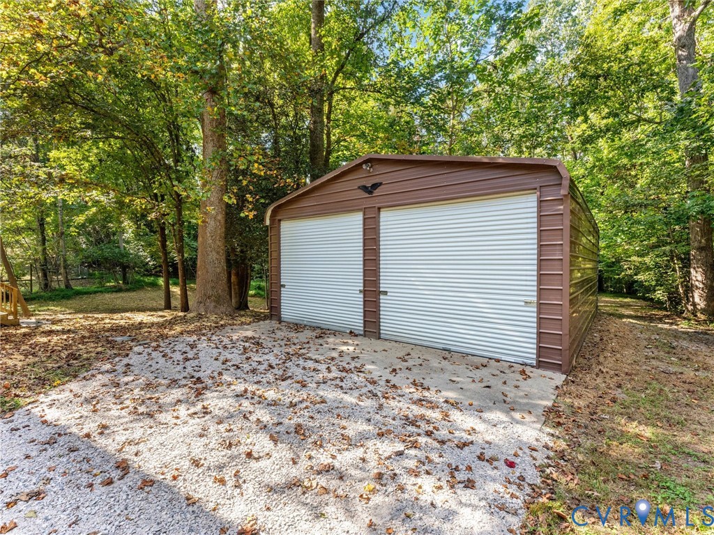 6518 Jessup Road Chesterfield, VA 23832 - Photo 13 of 77 Two-bay metal carport with a concrete slab foundat