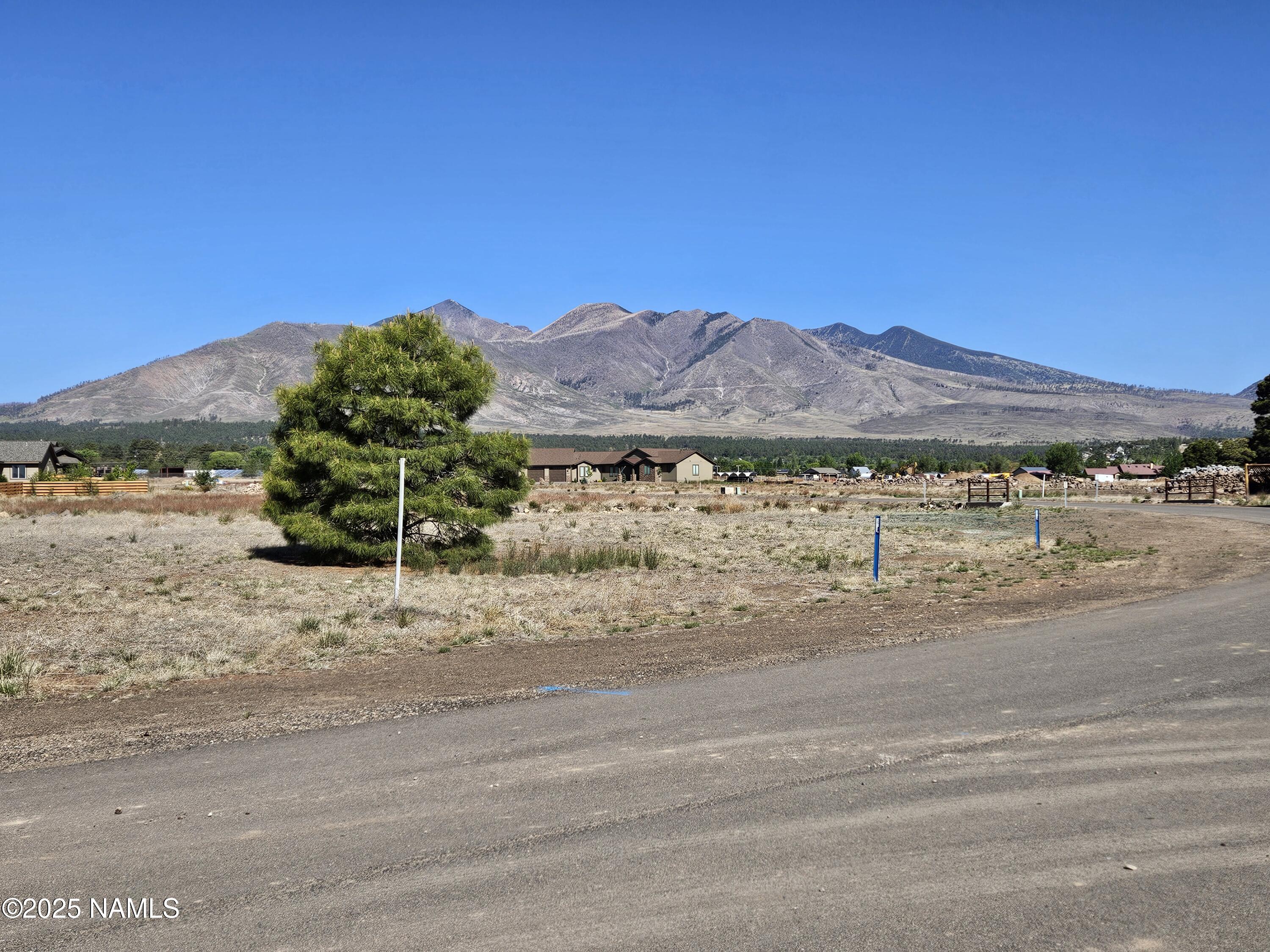 6668 Johnson Ranch Road Flagstaff, AZ 86004 - Photo 3 of 5 a view of a road with an ocean view