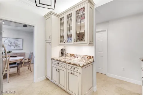 a view of a dining room with furniture wooden floor and chandelier