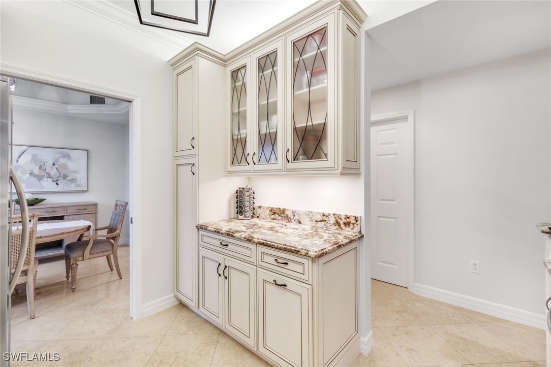 401 Bayfront Place, Unit 3301 Naples, FL 34102 - Photo 12 of 30 a kitchen with stainless steel appliances granite countertop a stove and a sink