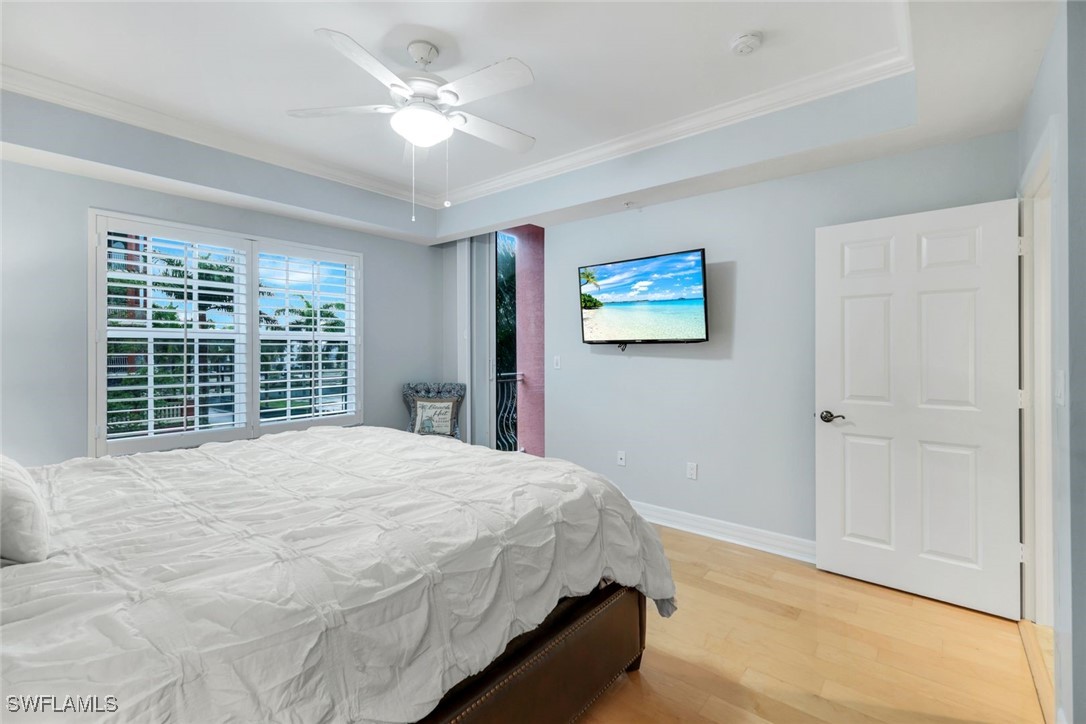 401 Bayfront Place, Unit 3301 Naples, FL 34102 - Photo 16 of 30 a bedroom with a large bed and a window