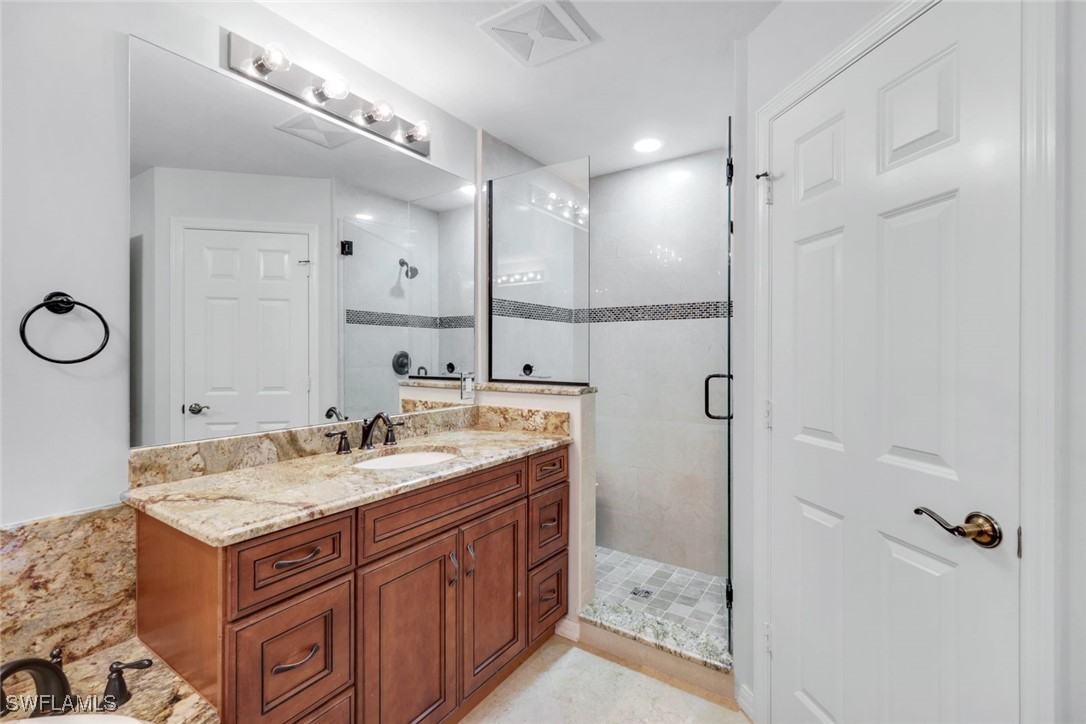 401 Bayfront Place, Unit 3301 Naples, FL 34102 - Photo 19 of 30 a bathroom with a sink and a mirror