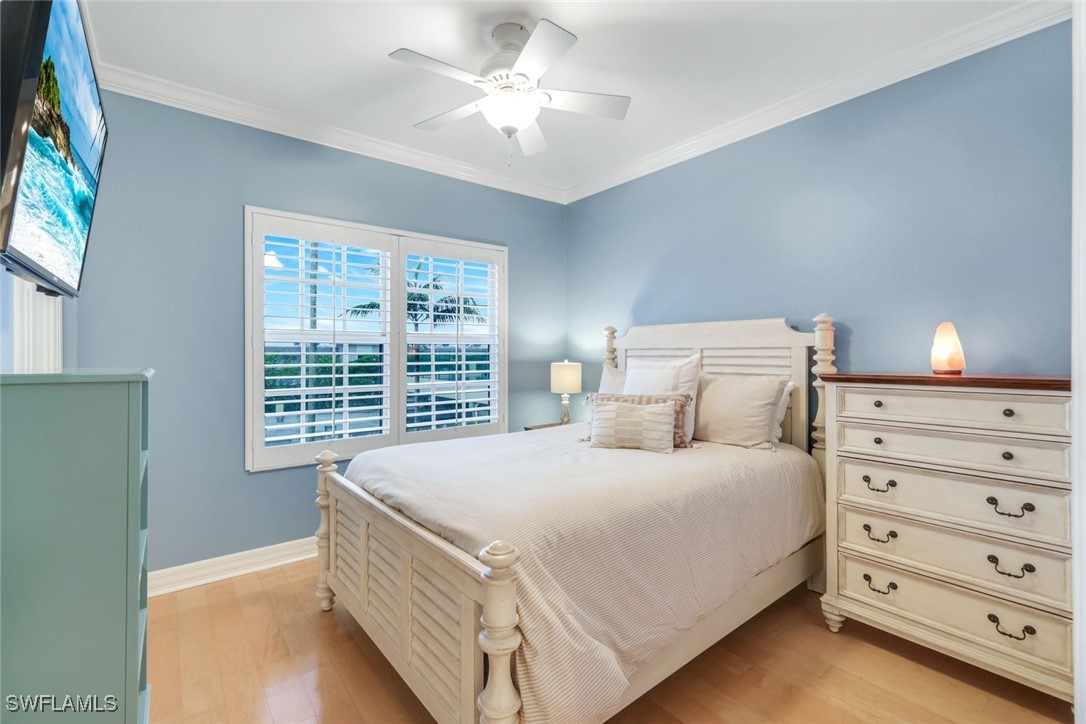 401 Bayfront Place, Unit 3301 Naples, FL 34102 - Photo 20 of 30 a bedroom with a bed and a window