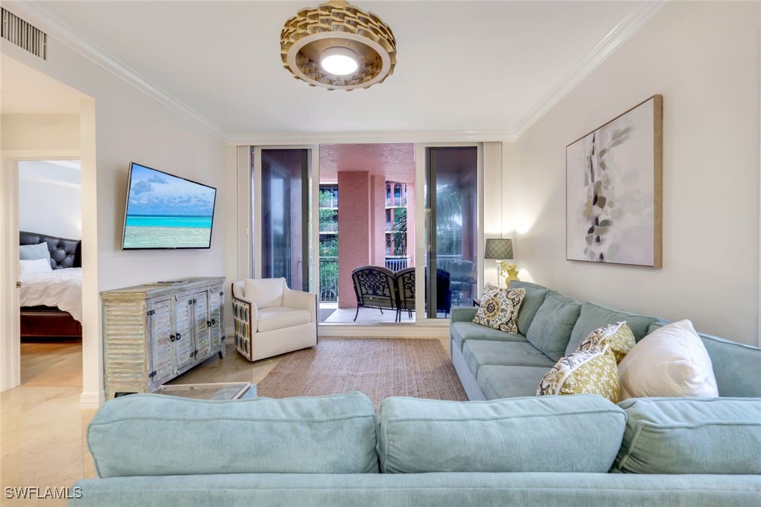 401 Bayfront Place, Unit 3301 Naples, FL 34102 - Photo 4 of 30 a living room with furniture and a fireplace