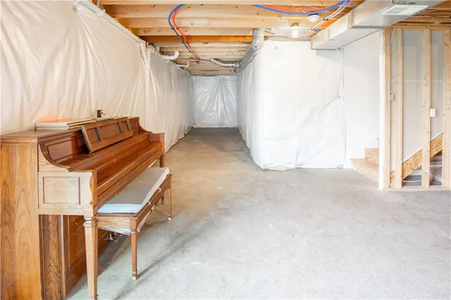 a view of a room with stairs and a wooden floor