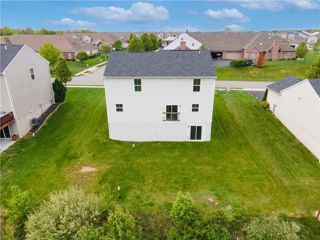 an aerial view of a house with a garden