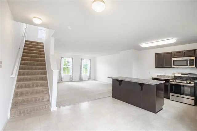 a view of living room with furniture and flat screen tv