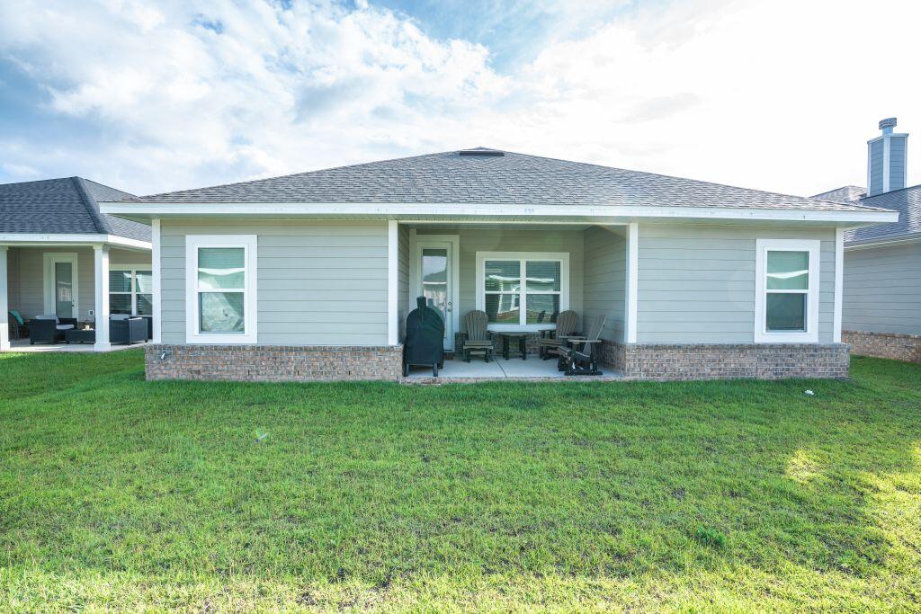 113 Cool Breeze Drive Freeport, FL 32439 - Photo 16 of 16 a view of a house with a backyard