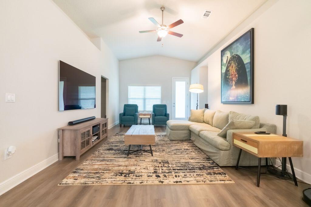 113 Cool Breeze Drive Freeport, FL 32439 - Photo 2 of 16 a living room with furniture and a flat screen tv