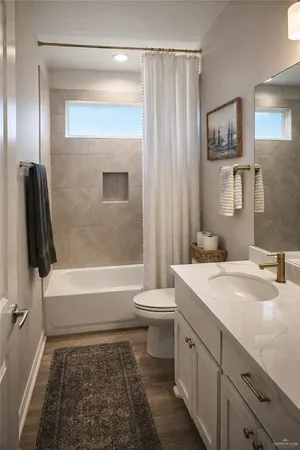 a bathroom with a tub a sink and a large mirror