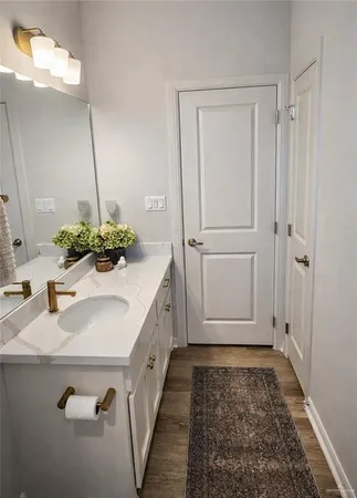 a bathroom with a sink and mirror