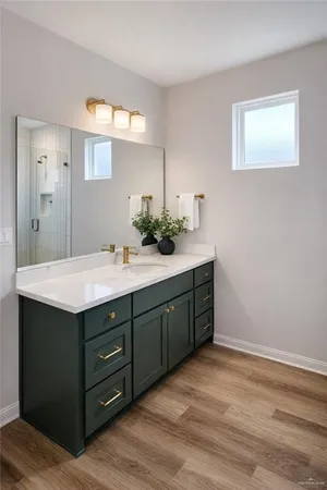 a bathroom with a sink double vanity and a mirror