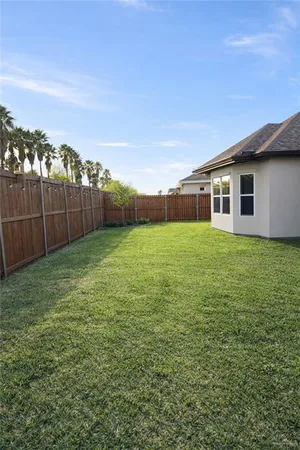 a view of a backyard of the house
