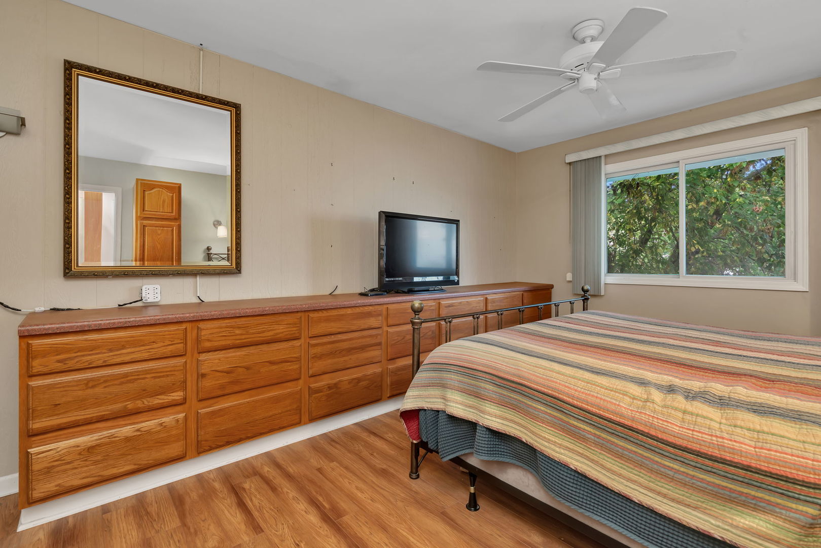 522 Julie Road Bolingbrook, IL 60440 - Photo 13 of 28 a bedroom with a bed and a flat screen tv